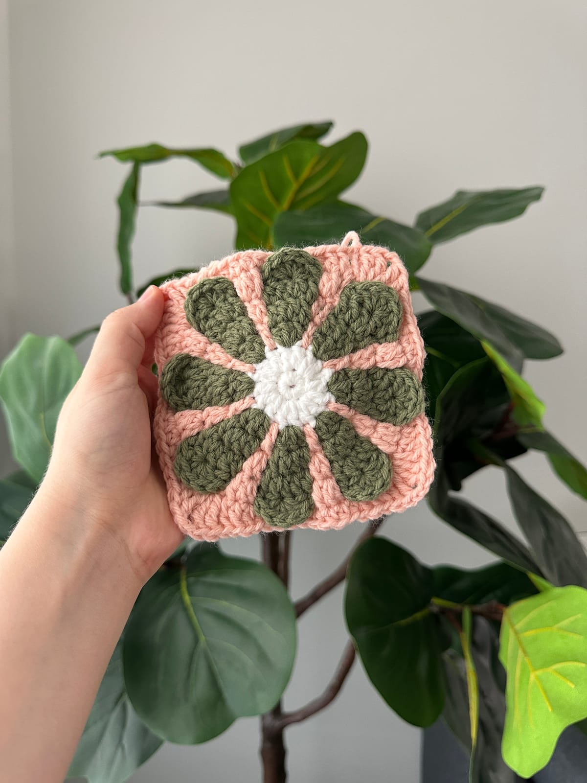 A granny square pattern diagram card beside a granny square in progress